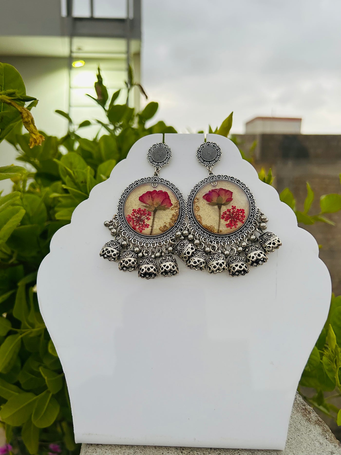 Elegant Jhumka Style Resin Earrings with Red Rose