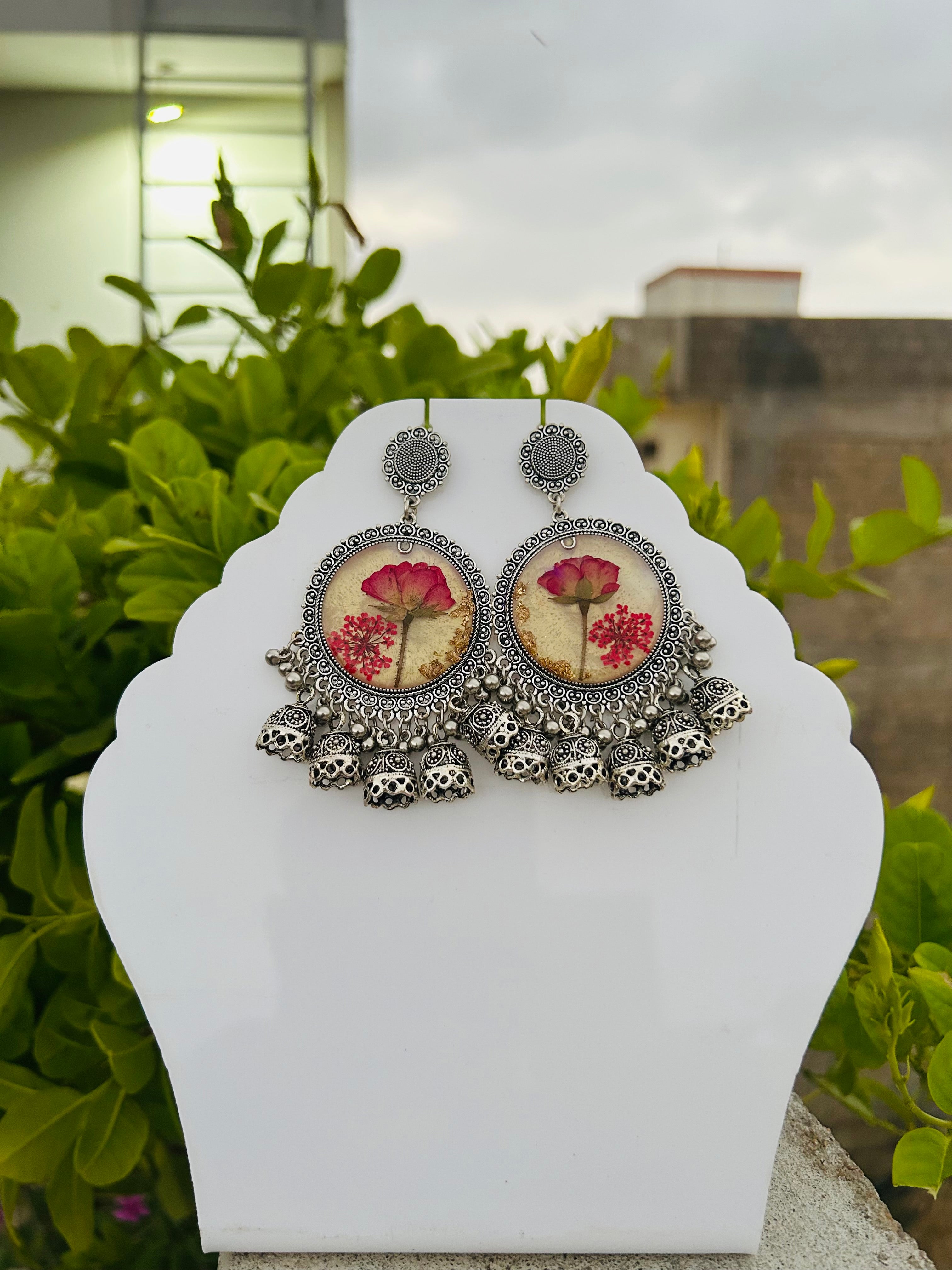 Elegant Jhumka Style Resin Earrings with Red Rose